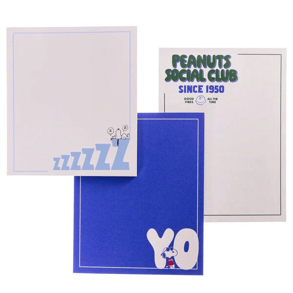 Three Peanuts-themed notepads featuring Snoopy designs and text like 'YO', 'ZZZZ', and 'Peanuts Social Club Since 1950'
